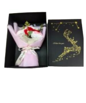 wool flower in box with sign