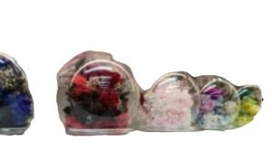 Alternative view of natural preserved rose in a sphere glass